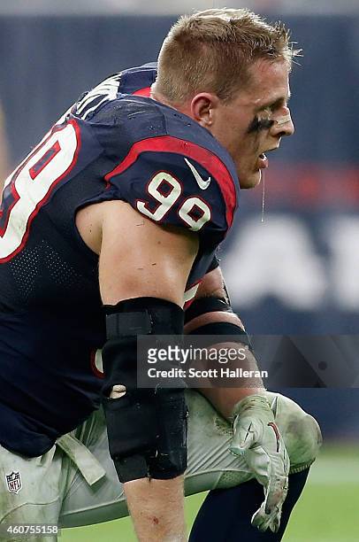 Watt of the Houston Texans waits on the field during their game against the Baltimore Ravens at NRG Stadium on December 21, 2014 in Houston, Texas.