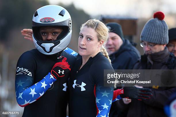 Aja Evans and Jamie Greubel of United States look thoughtful after their forth place after the second run of bob women competition during the FIBT...