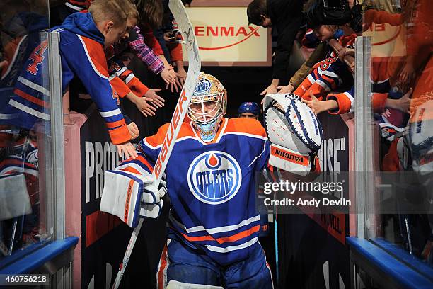 Ben Scrivens of the Edmonton Oilers makes his way to the ice prior to the game against the Dallas Stars on December 21, 2014 at Rexall Place in...