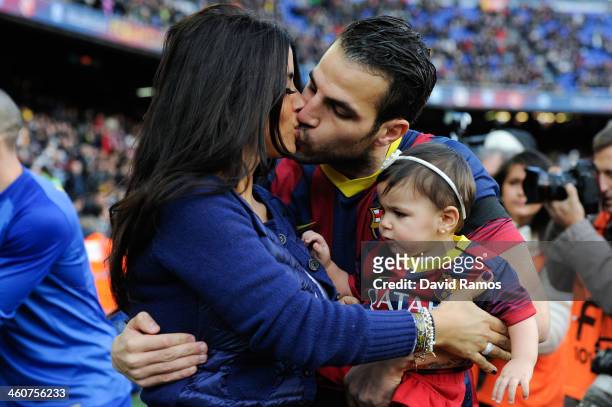 Cesc Fabregas of FC Barcelona kisses his girlfriend Daniella Semaan as he holds his daughter Lia during the La Liga match between FC Barcelona and...