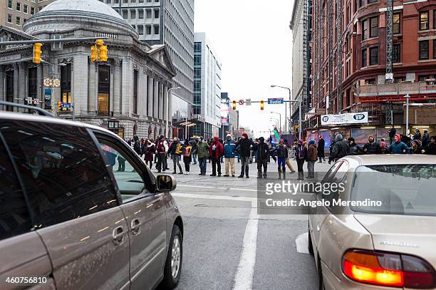 Demonstrators lock arms and block traffic at Euclid and 9th Street December 21 in Cleveland, Ohio. Protestors gathered to voice opposition to...