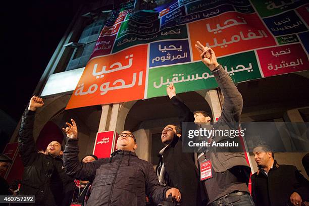 Supporters of Tunisian Nidaa Tounes Party's chief and presidential candidate Beji Caid Essebsi celebrate after the first results following the second...