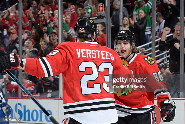 Patrick Kane of the Chicago Blackhawks reacts after Kris Versteeg scored against the Toronto Maple Leafs in the first period during the NHL game at...