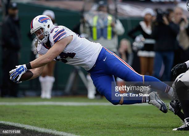 Scott Chandler of the Buffalo Bills scores a touchdown in the fourth quarter against the Oakland Raiders at O.co Coliseum on December 21, 2014 in...