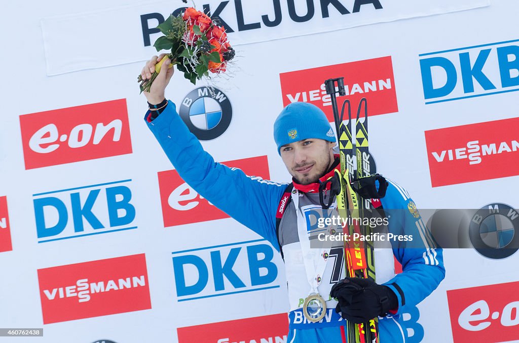 Anton Shipulin (RUS) on the podiumcelebrating his first...