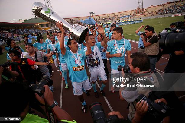 Players of Sporting Cristal lift the trophy after winning a final match between Sporting Cristal and Juan Aurich as part of Torneo Descentralizado...
