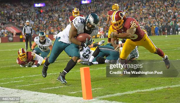 Philadelphia running back LeSean McCoy avoids Washington free safety Ryan Clark and dives for the end zone and a touchdown later in the first quarter...