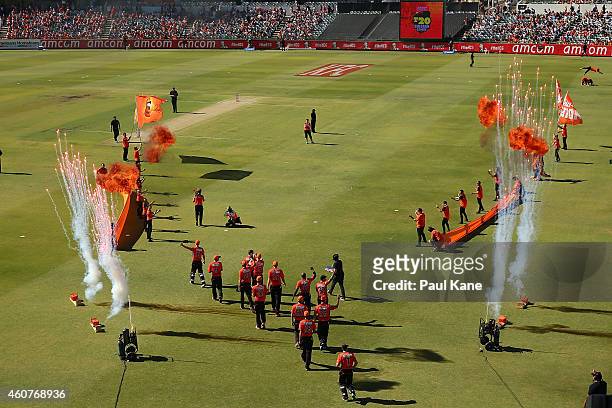 The Scorchers enter the field to present the 2013-14 championship trophy to the fans during the Big Bash League match between the Perth Scorchers and...