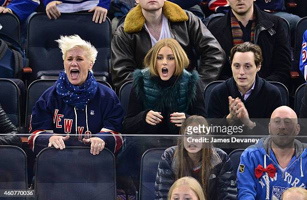 Anne Burrell, Olivia Palermo and Grant Palermo attend New York Rangers vs Carolina Hurricanes game at Madison Square Garden on December 21, 2014 in...