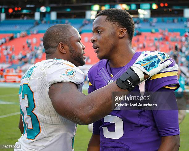 Jelani Jenkins of the Miami Dolphins talk to Teddy Bridgewater of the Minnesota Vikings after the game on December 21, 2014 at Sun Life Stadium in...