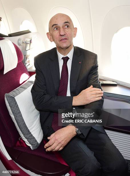 Former Airbus CEO Louis Gallois sits aboard an A350 during an hour flight over France on December 22, 2014. Airbus delivered its first...