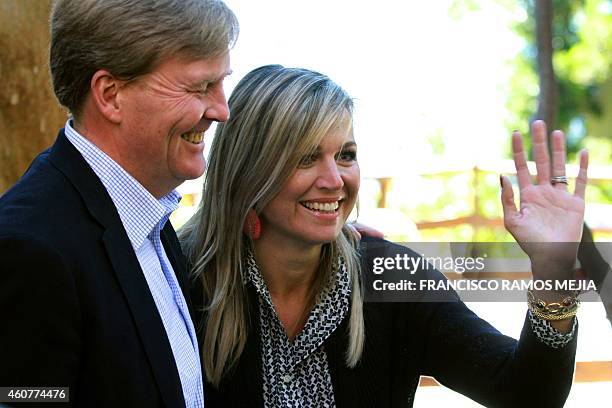 Dutch King Willem-Alexander gestures while Queen Maxima waves during a visit to the Bosque de Arrayanes near Villa La Angostura, Neuquen, Argentina,...