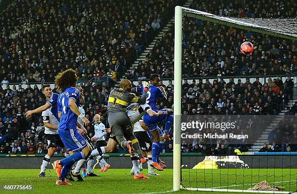 John Obi Mikel of Chelsea heads the ball to score their first goal during the Budweiser FA Cup Third Round match between Derby County and Chelsea at...