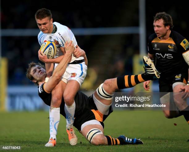 Henry Slade of Exeter is tackled by Joe Launchbury of Wasps during the Aviva Premiership match between London Wasps and Exeter Chiefs at Adams Park...