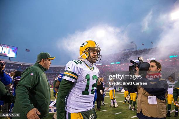 Aaron Rodgers of the Green Bay Packers walks off the field after losing to the Buffalo Bills on December 14, 2014 at Ralph Wilson Stadium in Orchard...