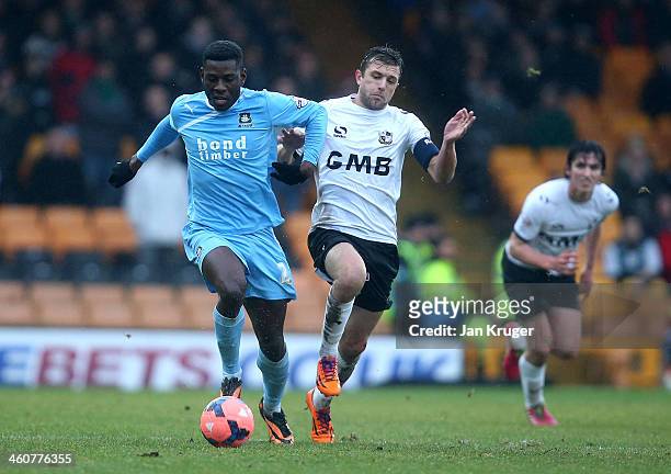 Temitope Obadeyi of Plymouth Argyle holds off Doug Loft of Port Vale during the Budweiser FA Cup third round match between Port Vale and Plymouth...