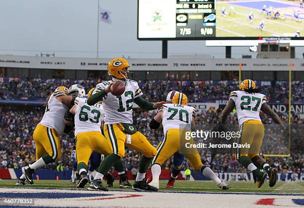 Aaron Rodgers of the Green Bay Packers looks to pass against the Buffalo Bills during the second half at Ralph Wilson Stadium on December 14, 2014 in...