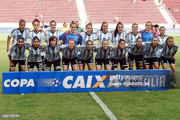 The Argentine women's national football team poses before a match of the 2014 Brasilia International Tournament at the Mane Garrincha national...