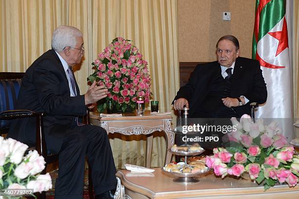 In this handout photo provided by the Palestinian Press Office , Palestinian President, Mahmoud Abbas during a meeting with Algerian President,...