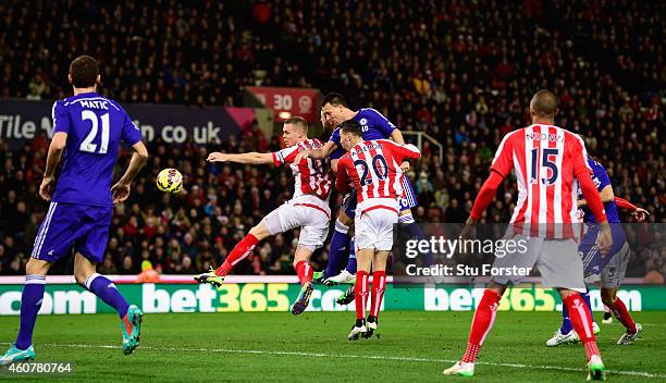 Chelsea player John Terry heads in the opening goal during the Barclays Premier League match between Stoke City and Chelsea at Britannia Stadium on...