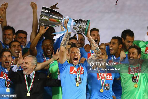 Marek Hamsik, Captain of Napoli lifts the trophy after winning the 2014 Italian Super Cup match between Juventus FC v SSC Napoli at the Jassim Bin...