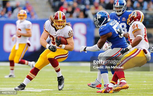 Logan Paulsen of the Washington Redskins in action against Jameel McClain of the New York Giants on December 14, 2014 at MetLife Stadium in East...