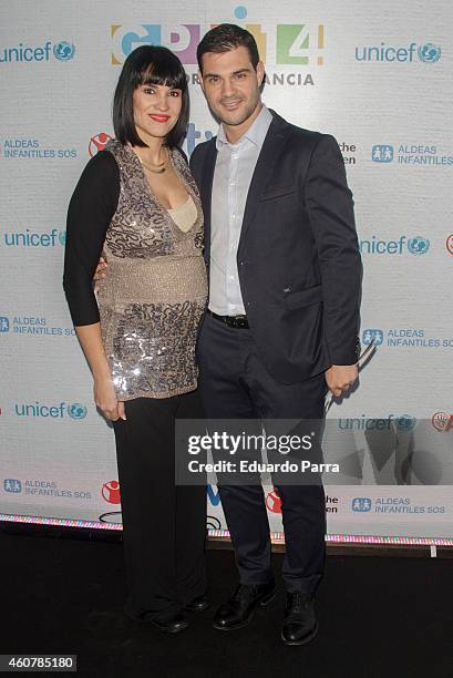 Irene Villa and Juan Pablo Lauro attends the Gala for Children photocall at Magarinos sports center on December 22, 2014 in Madrid, Spain.