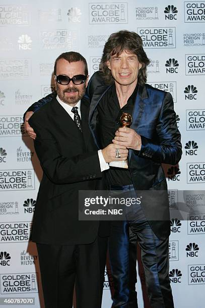 Pictured: David A. Stewart and Mick Jagger pose in the press room with the award for Best Original Song for 'Old Habits Die Hard' at the 62nd Annual...