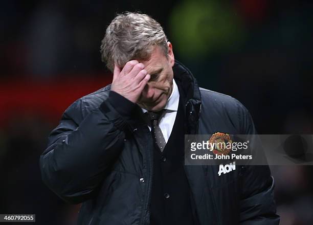 Manager David Moyes of Manchester United walks off after during the FA Cup Third Round match between Manchester United and Swansea City at Old...