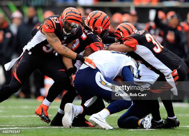 Defensive back Chris Crocker and outside linebacker Vontaze Burfict of the Cincinnati Bengals sack quarterback Philip Rivers of the San Diego...