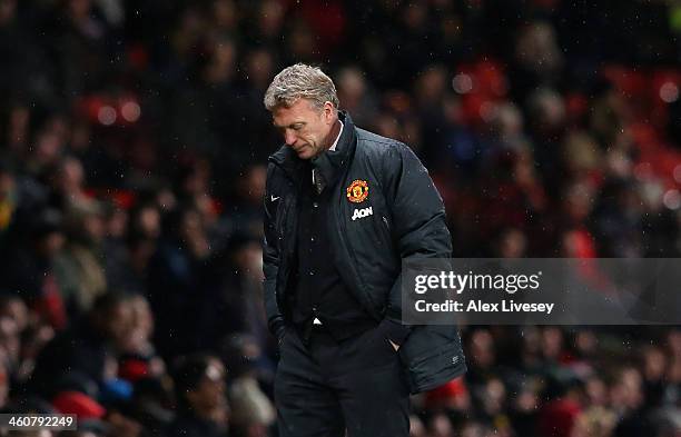 Manchester United Manager David Moyes reacts during the FA Cup with Budweiser Third round match between Manchester United and Swansea City at Old...