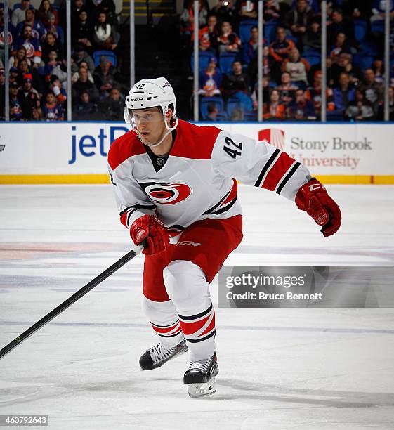 Brett Sutter of the Carolina Hurricanes skates against the New York Isalnders at the Nassau Veterans Memorial Coliseum on January 4, 2014 in...