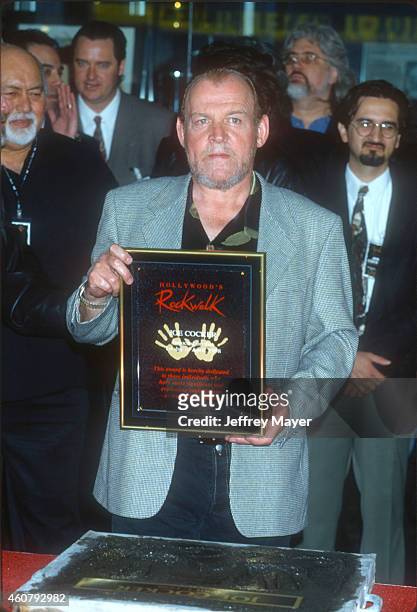 Singer Joe Cocker is inducted to Hollywood's Rock Walk on April 1, 1998 at the Guitar Center in Hollywood, California.