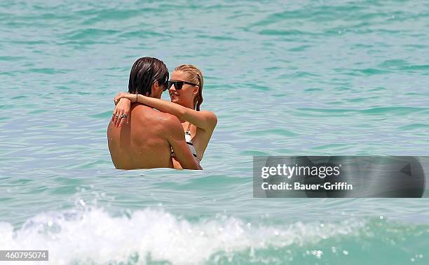 Sami Khedira and his girlfriend Lena Gercke are seen while swimming in the ocean on July 12, 2012 in Miami, Florida.