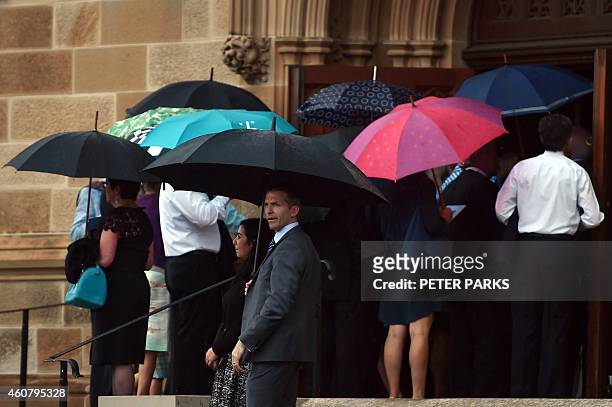 Visitors enter the Great Hall at the University of Sydney for the memorial service of Katrina Dawson in Sydney on December 23, 2014. Dawson was...
