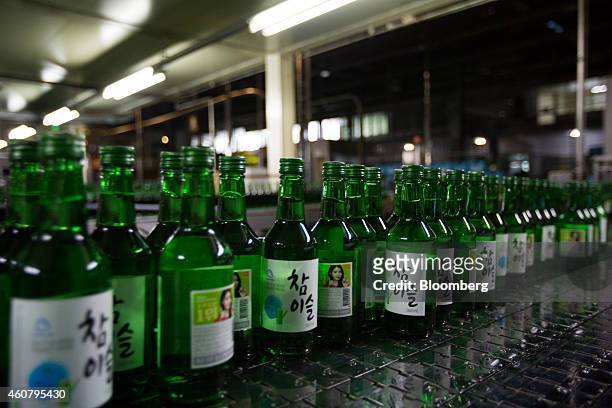bottles-of-soju-move-along-a-conveyor-on