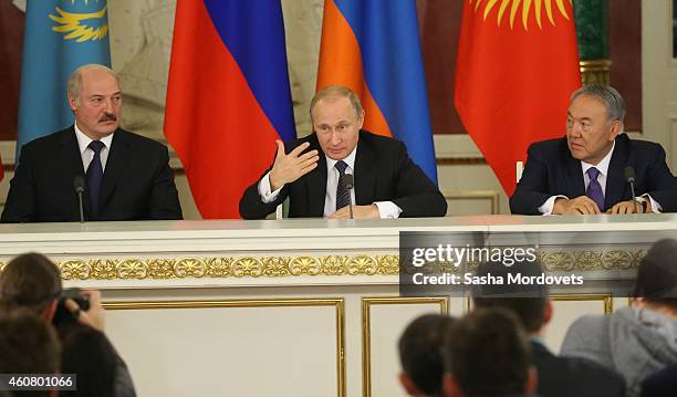 Russian President Vladimir Putin talks as Belarussian President Alexander Lukashenko and Kazakh President Nursiltan Nazarbayev during the Summit of...