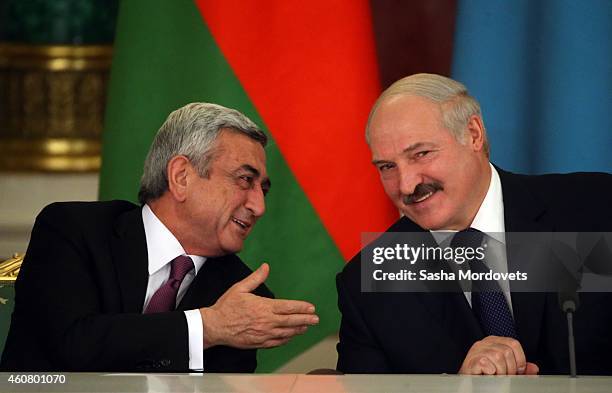 Belarussian President Alexander Lukashenko listens to Armenian President Serge Sargsyan during the Summit of Collective Security Treaty Organisation...