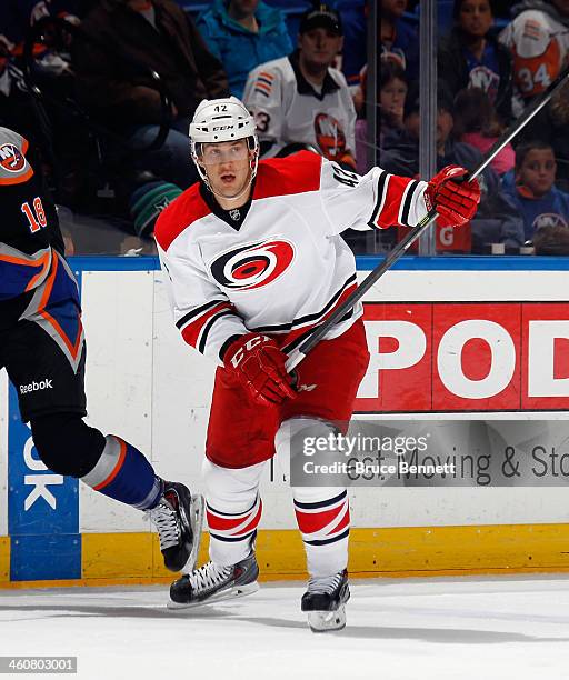 Brett Sutter of the Carolina Hurricanes skates against the New York Isalnders at the Nassau Veterans Memorial Coliseum on January 4, 2014 in...