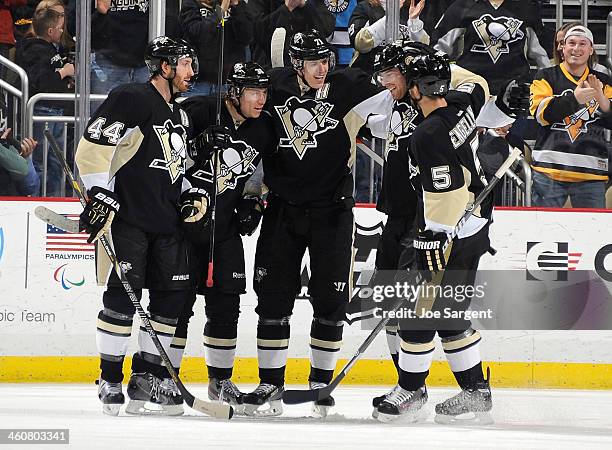 Jussi Jokinen of the Pittsburgh Penguins celebrates his goal with teammates during the second period against the Winnipeg Jets on January 5, 2014 at...