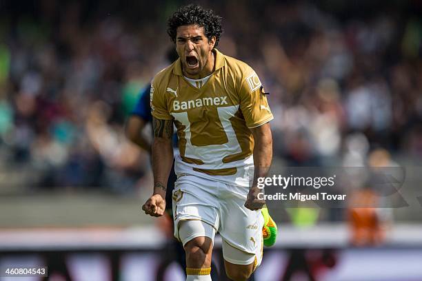 Martin Bravo of Pumas celebrates a scored goal against Puebla during a match between Pumas UNAM and Puebla as part of the Clausura 2014 Liga MX at...