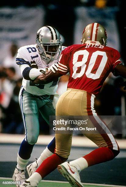 Defensive back Deion Sanders of the Dallas Cowboys in action guarding wide receiver Jerry Rice of the San Francisco 49ers November 12, 1995 during an...
