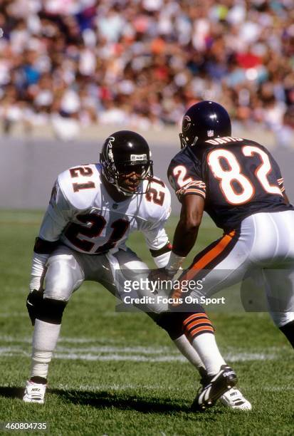 Defensive back Deion Sanders of the Atlanta Falcons in action guarding Wide receiver Wendell Davis of the Chicago Bears November 11, 1990 during an...