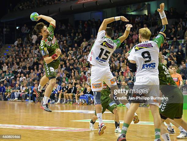 Fabian Wiede of Fuechse Berlin, Zarko Sesum and Manuel Spaeth of Frisch Auf Goeppingen in action during the game between Fuechse Berlin and Frisch...