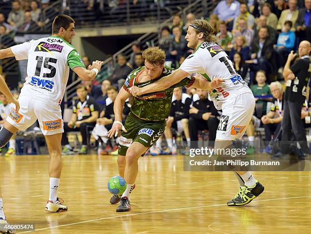 Zarko Sesum, Paul Drux of Fuechse Berlin and Felix Lobedank of Frisch Auf Goeppingen in action during the game between Fuechse Berlin and Frisch Auf...