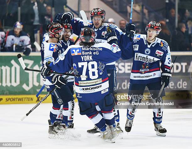 Nicholas Petersen of Iserlohn Roosters celebrates with team mates as he scores the opening goal during the DEL Ice Hockey match between Iserlohn...
