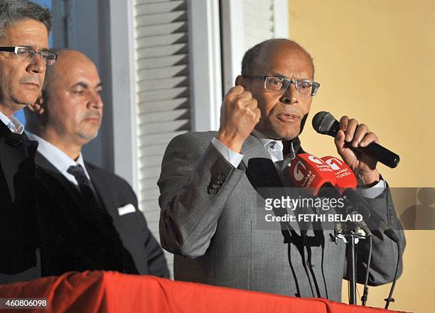 Tunisia's outgoing president Moncef Marzouki adresses his supporters at his campaign headquarters on December 23, 2014 in Tunis, a day after his...