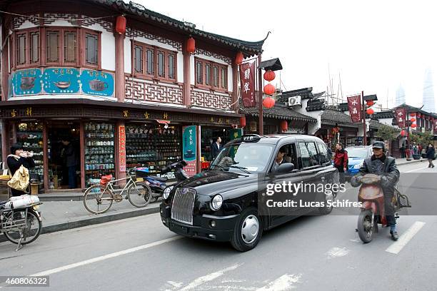 Black cab', famous in London, is parked in Shanghai's old town neighborhood on March 23, 2009 in Shanghai, China. London Taxi International, the...