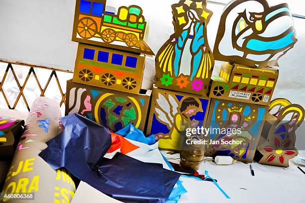 Paper lanterns in progress are seen in a workshop prior the annual Festival of Candles and Lanterns on December 08, 2013 in Quimbaya, Colombia. A...