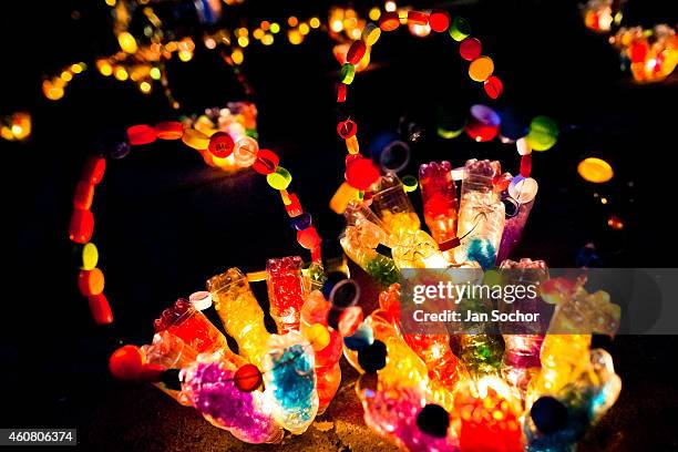 Lanterns made out of plastic bottles are displayed on the street during the annual Festival of Candles and Lanterns on December 08, 2013 in Quimbaya,...